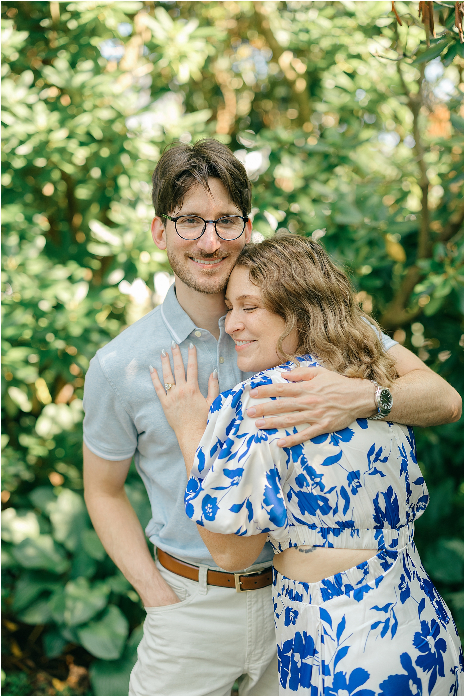 Engaged couple sharing a close embrace during their romantic garden engagement session in Maryland